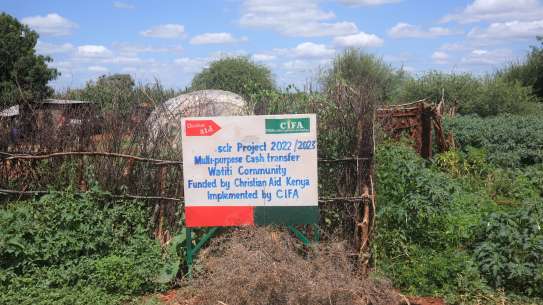 Sign on fence