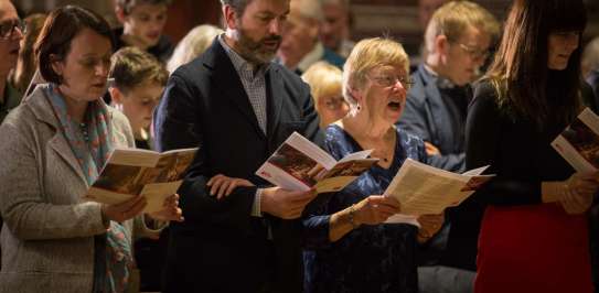 Christian Aid congregation singing at church service