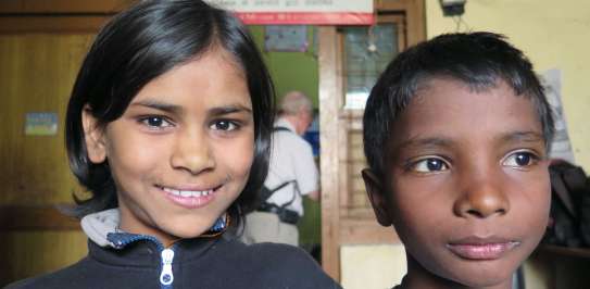 Charisma, 10, and her friend at the Bridge school run by Christian Aid partner, Phia, in Bhowpur, India.