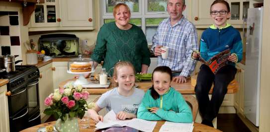 Susie Hamilton with her family in their home in Saintfield, County Down