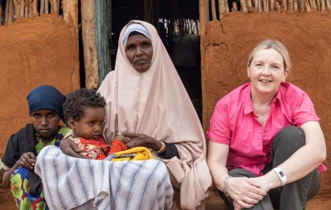 Women sitting with children