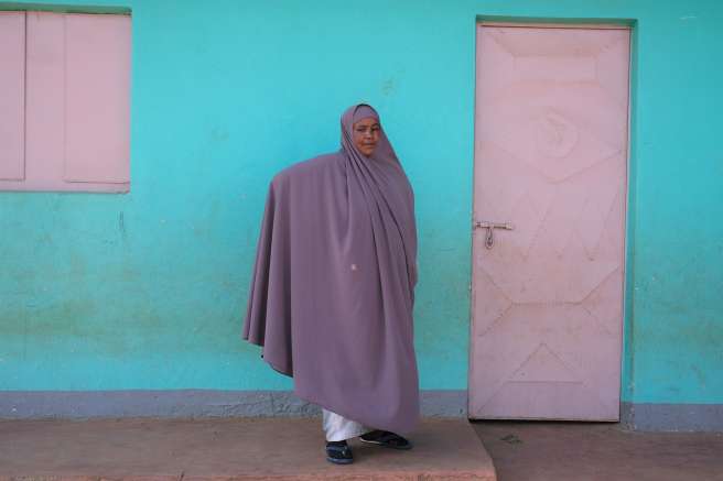 Woman standing in front of building