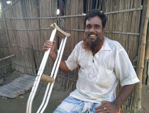 Suruz Mia sits outside his home in Kala Kanda village in Dewangonj area of Jampalpur in northern Bangladesh. Thanks to Irish Aid support, Suruz received cash from Christian Aid’s local partner Dhaka Ahsania Mission (DAM) to buy food as well as reusable facemasks and hand sanitiser to help protect him and his family from catching and passing on coronavirus. 