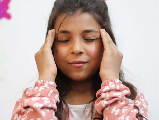 Girl practicing relaxing techniques