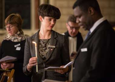 Attendees pray, reflect and sing hymns at of the Service of Thanksgiving