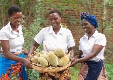 Makande Womens Group members holding baobab fruit