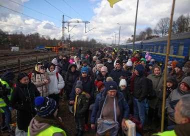 Ukrainians arrive at a Polish train station