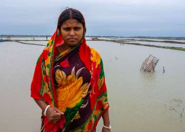 Shikha standing at floods in Bangladesh